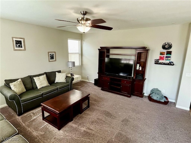 living room featuring a ceiling fan, baseboards, and carpet floors
