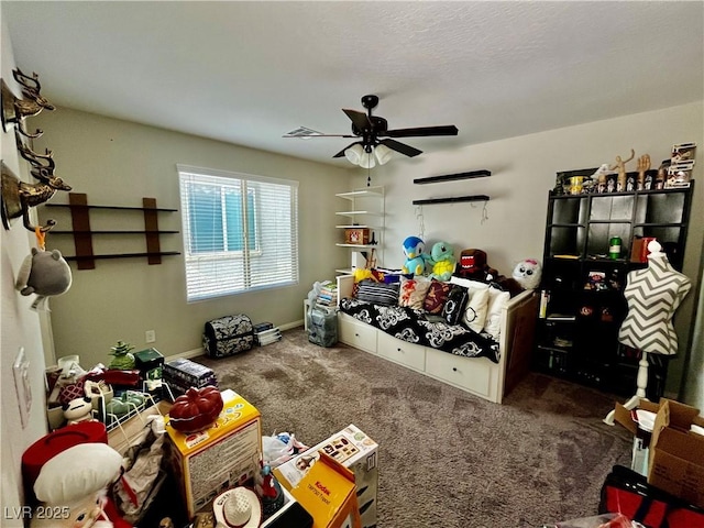 playroom featuring a ceiling fan, carpet flooring, and baseboards