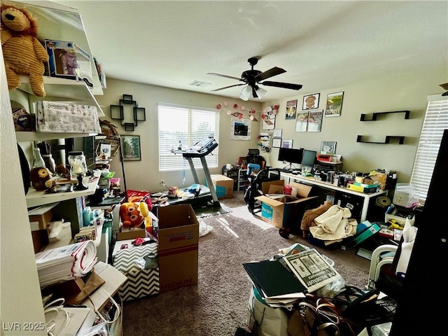 home office featuring carpet flooring and a ceiling fan