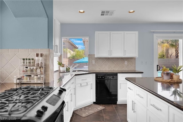 10902 Fintry Hills St, Las Vegas, NV 89141 - kitchen with stainless steel gas range oven, black dishwasher, dark tile patterned flooring, a sink, and backsplash