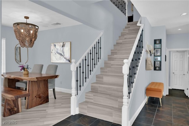 10902 Fintry Hills St, Las Vegas, NV 89141 - stairs featuring baseboards, tile patterned flooring, a chandelier, and recessed lighting