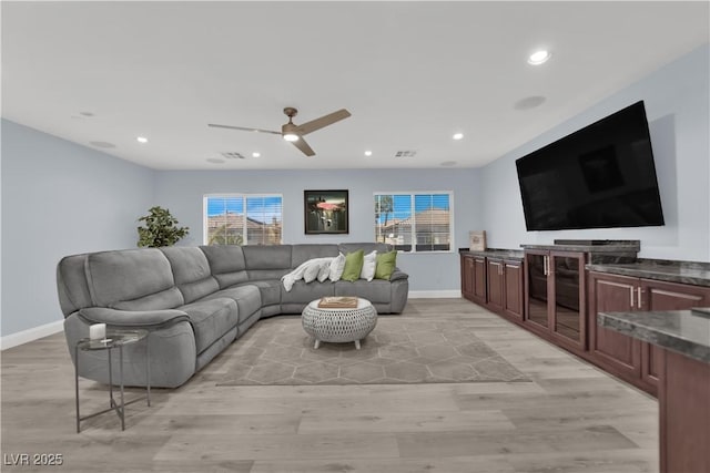 10902 Fintry Hills St, Las Vegas, NV 89141 - living room featuring light wood-type flooring, a ceiling fan, plenty of natural light, recessed lighting, and baseboards