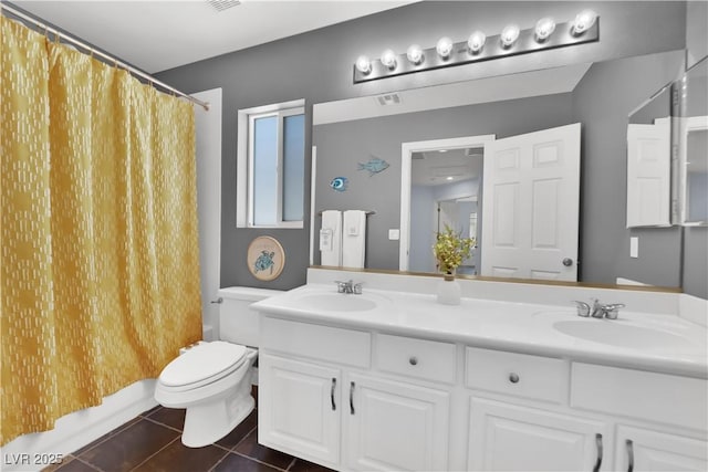 10902 Fintry Hills St, Las Vegas, NV 89141 - full bathroom with tile patterned flooring, double vanity, toilet, and shower / bath combo