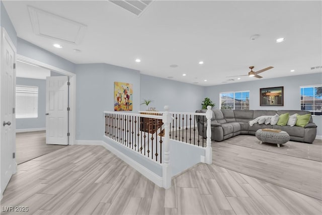 10902 Fintry Hills St, Las Vegas, NV 89141 - corridor featuring wood finished floors, recessed lighting, plenty of natural light, baseboards, and attic access