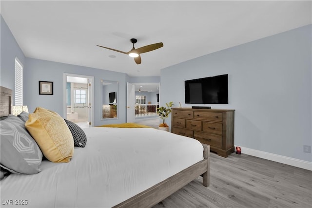 10902 Fintry Hills St, Las Vegas, NV 89141 - bedroom with baseboards, wood finished floors, connected bathroom, and a ceiling fan