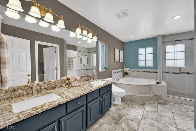10902 Fintry Hills St, Las Vegas, NV 89141 - full bathroom featuring a garden tub, a shower stall, double vanity, and toilet