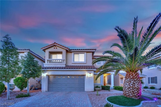 10902 Fintry Hills St, Las Vegas, NV 89141 - mediterranean / spanish-style home with a tile roof, a garage, decorative driveway, and stucco siding