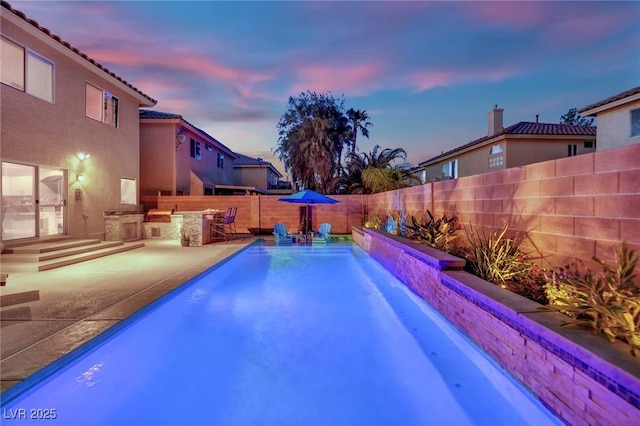 10902 Fintry Hills St, Las Vegas, NV 89141 - view of swimming pool with a fenced backyard, an outdoor kitchen, and a patio area