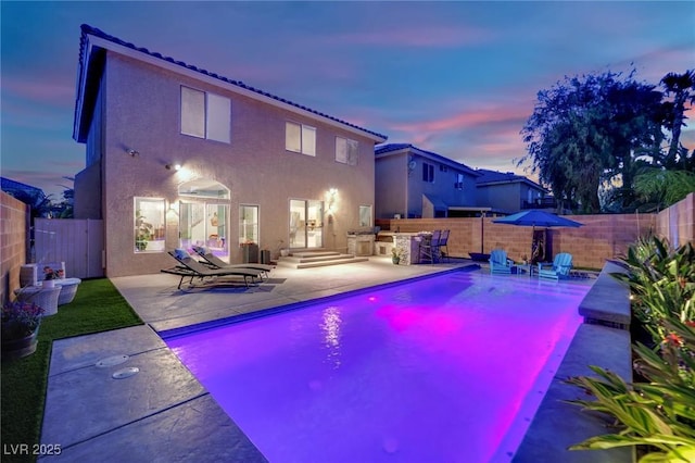 10902 Fintry Hills St, Las Vegas, NV 89141 - view of pool featuring a patio area, a fenced backyard, and exterior kitchen