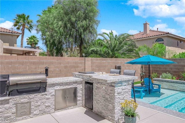 10902 Fintry Hills St, Las Vegas, NV 89141 - view of patio with area for grilling, fence, grilling area, and exterior bar