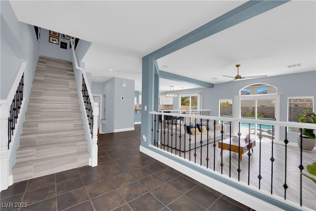 10902 Fintry Hills St, Las Vegas, NV 89141 - stairs featuring tile patterned floors, ceiling fan, recessed lighting, baseboards, and a chandelier