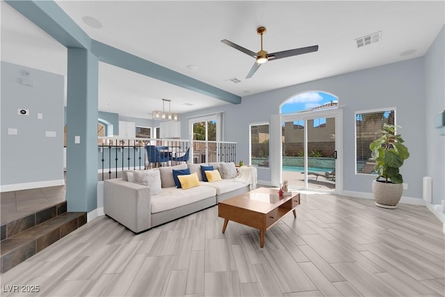 10902 Fintry Hills St, Las Vegas, NV 89141 - living area featuring a chandelier, a ceiling fan, wood tiled floors, and baseboards