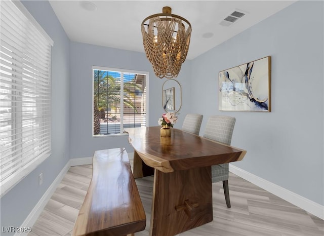 10902 Fintry Hills St, Las Vegas, NV 89141 - dining area featuring a chandelier, baseboards, and light wood-style floors