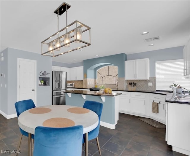 10902 Fintry Hills St, Las Vegas, NV 89141 - dining room with recessed lighting, baseboards, and dark tile patterned flooring