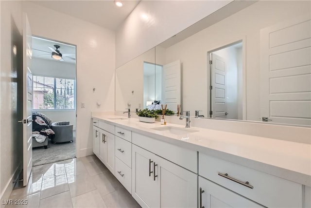 5321 Brayden Ct, Las Vegas, NV 89131 - full bathroom with double vanity, a ceiling fan, and baseboards