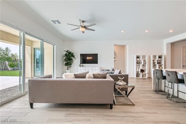 5321 Brayden Ct, Las Vegas, NV 89131 - living area featuring a ceiling fan, light wood-style floors, and recessed lighting