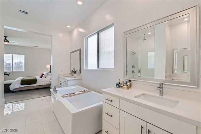 5321 Brayden Ct, Las Vegas, NV 89131 - ensuite bathroom featuring a shower stall, vanity, a freestanding bath, recessed lighting, and tile patterned flooring