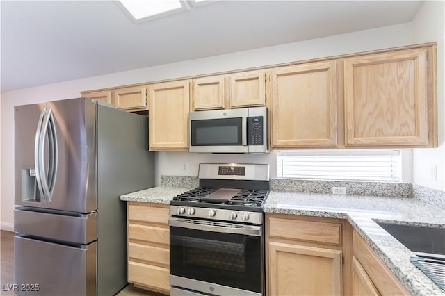 2185 High Mesa Dr, Henderson, NV 89012 - kitchen featuring stainless steel appliances, light brown cabinetry, and light stone counters