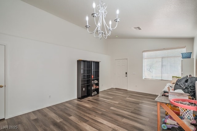 2920 Riarosa Ct, North Las Vegas, NV 89086 - interior space with a chandelier, wood finished floors, baseboards, and a towering ceiling