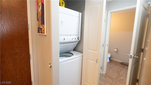 8255 S Las Vegas Blvd Unit 1514, Las Vegas, NV 89123 - laundry area with stacked washer / dryer and light tile patterned floors