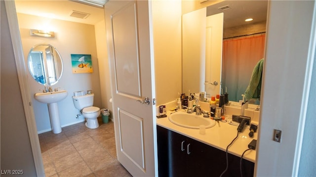 8255 S Las Vegas Blvd Unit 1514, Las Vegas, NV 89123 - full bathroom with a sink, toilet, and tile patterned flooring