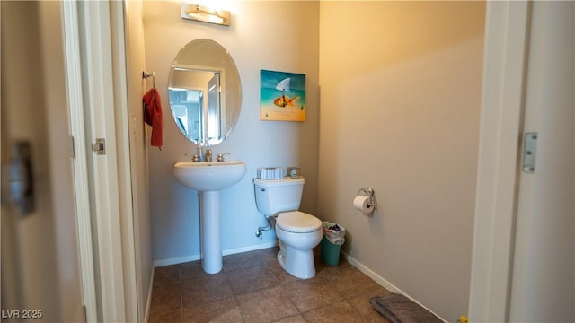 8255 S Las Vegas Blvd Unit 1514, Las Vegas, NV 89123 - bathroom with tile patterned floors, toilet, baseboards, and a sink