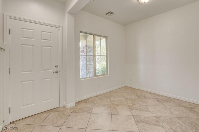 1055 Fish Pond Ave, Henderson, NV 89014 - foyer entrance with light tile patterned flooring and baseboards