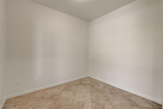 1055 Fish Pond Ave, Henderson, NV 89014 - spare room featuring baseboards and light tile patterned floors