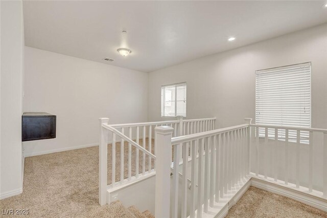 1055 Fish Pond Ave, Henderson, NV 89014 - hall with an upstairs landing, carpet, recessed lighting, and baseboards