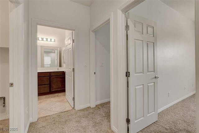 1055 Fish Pond Ave, Henderson, NV 89014 - hallway with light carpet and baseboards