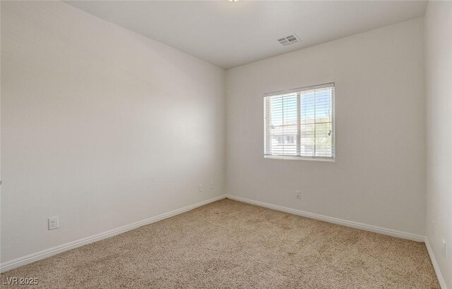 1055 Fish Pond Ave, Henderson, NV 89014 - spare room featuring carpet and baseboards