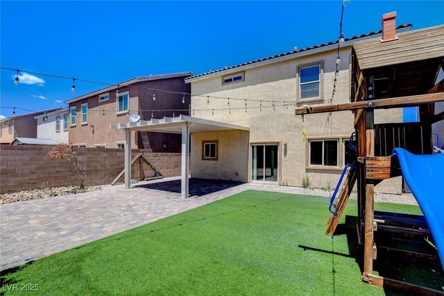 1055 Fish Pond Ave, Henderson, NV 89014 - back of house featuring stucco siding and a patio