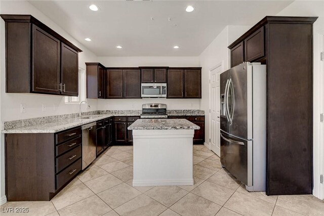 1055 Fish Pond Ave, Henderson, NV 89014 - kitchen featuring stainless steel appliances, a sink, dark brown cabinets, a kitchen island, and recessed lighting