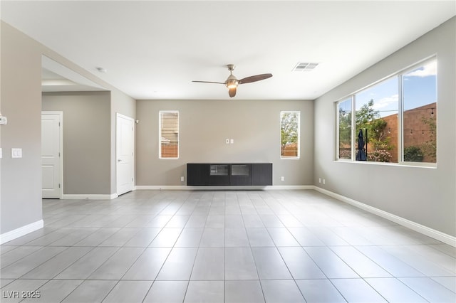 5981 Smith Valley Rd, Las Vegas, NV 89148 - unfurnished living room with a ceiling fan, baseboards, and tile patterned flooring