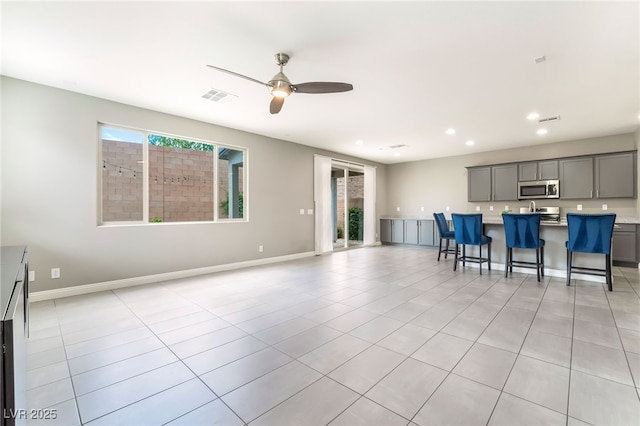 5981 Smith Valley Rd, Las Vegas, NV 89148 - living room with recessed lighting, a ceiling fan, light tile patterned floors, and baseboards