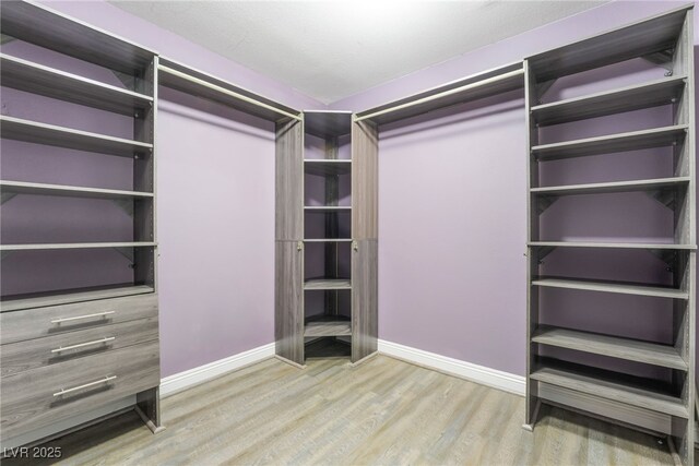 5981 Smith Valley Rd, Las Vegas, NV 89148 - spacious closet featuring wood finished floors