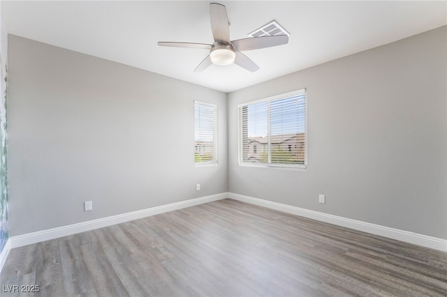 5981 Smith Valley Rd, Las Vegas, NV 89148 - unfurnished room with wood finished floors, ceiling fan, and baseboards