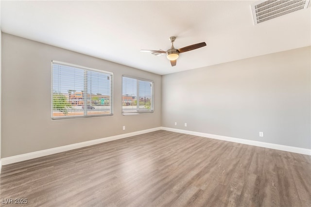 5981 Smith Valley Rd, Las Vegas, NV 89148 - empty room featuring wood finished floors, ceiling fan, and baseboards