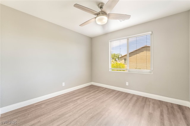 5981 Smith Valley Rd, Las Vegas, NV 89148 - spare room featuring light wood-type flooring, baseboards, and a ceiling fan