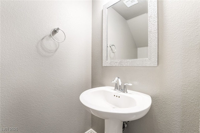 5981 Smith Valley Rd, Las Vegas, NV 89148 - bathroom featuring a sink and a textured wall