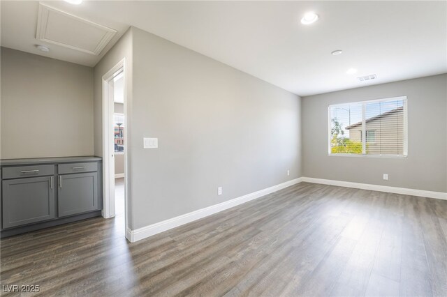 5981 Smith Valley Rd, Las Vegas, NV 89148 - empty room featuring dark wood-type flooring, baseboards, recessed lighting, and attic access