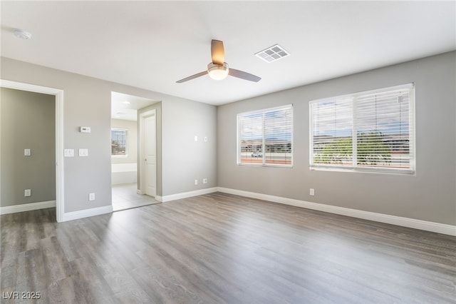5981 Smith Valley Rd, Las Vegas, NV 89148 - unfurnished room featuring wood finished floors, a ceiling fan, baseboards, and a smoke detector