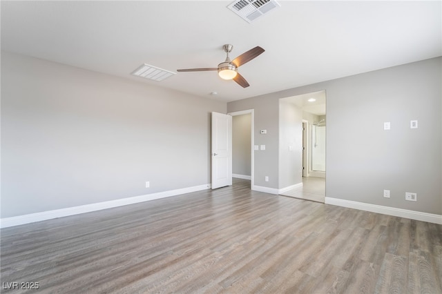 5981 Smith Valley Rd, Las Vegas, NV 89148 - unfurnished bedroom featuring wood finished floors, baseboards, and a ceiling fan