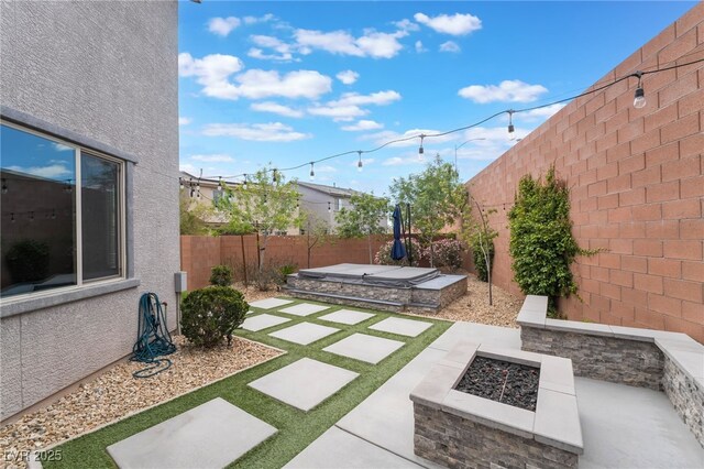 5981 Smith Valley Rd, Las Vegas, NV 89148 - fenced backyard featuring an outdoor fire pit and a patio