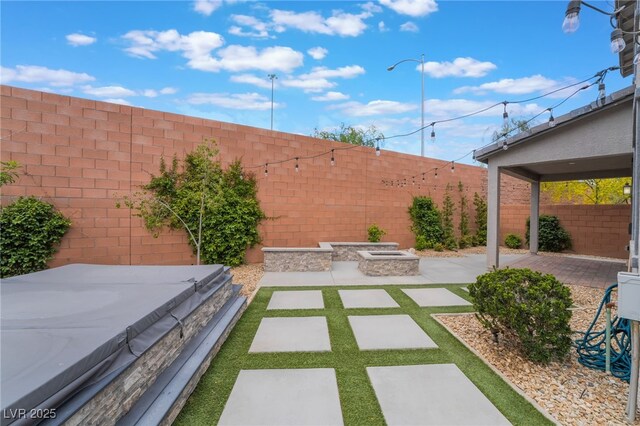 5981 Smith Valley Rd, Las Vegas, NV 89148 - fenced backyard with a hot tub and a patio