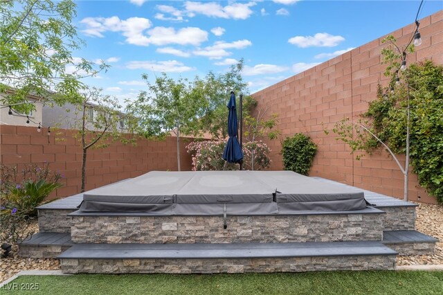 5981 Smith Valley Rd, Las Vegas, NV 89148 - exterior view of a jacuzzi and a fenced backyard