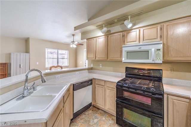 1557 Lake Placid Ter Unit 1557, Henderson, NV 89014 - kitchen with white microwave, stainless steel dishwasher, range with two ovens, and light brown cabinetry
