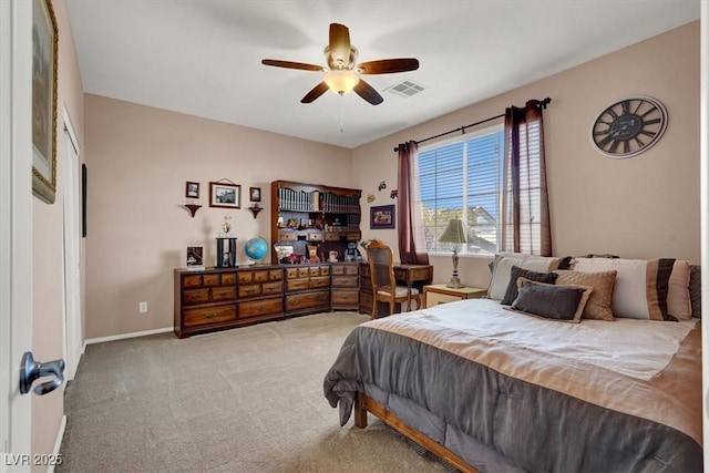 carpeted bedroom with baseboards and a ceiling fan