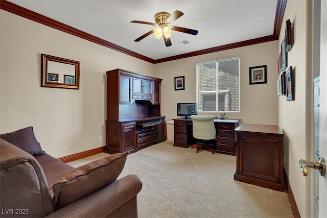 home office featuring a ceiling fan, ornamental molding, light carpet, and baseboards
