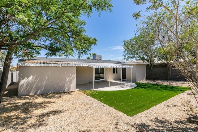 212 View Dr, Las Vegas, NV 89107 - back of property with a patio area and stucco siding